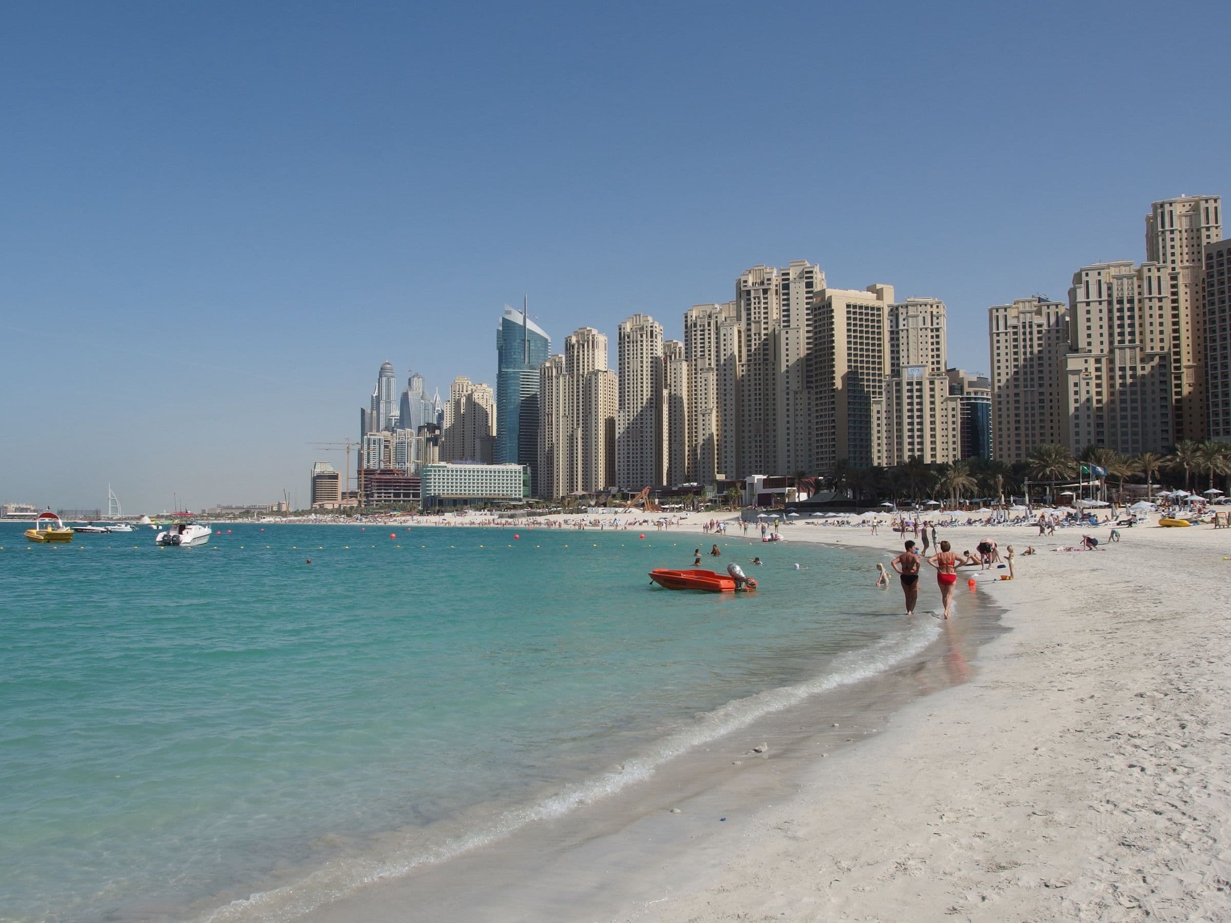 Jumeirah Beach Residence towers lining the public beach and shallow turquoise water, Dubai